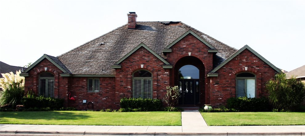 Before (sample): the same home with a worn, hail-damaged roof