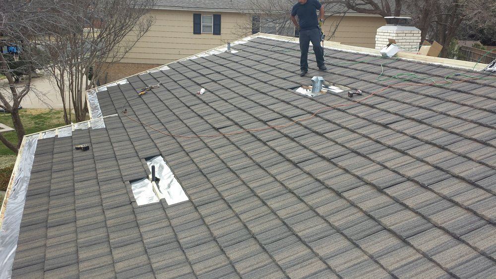 Roofer working on a tile roof